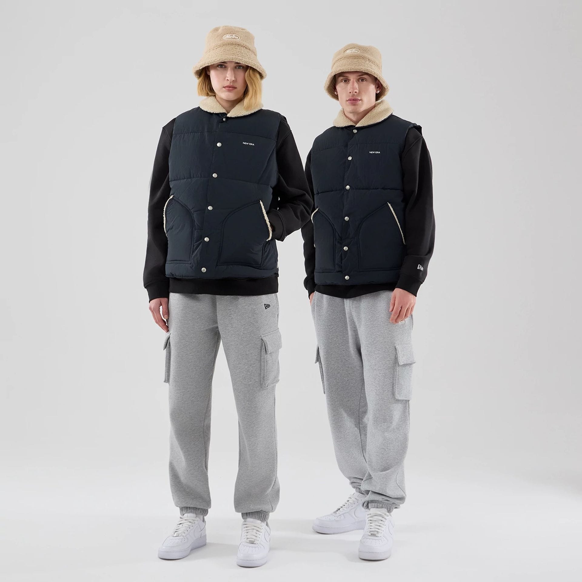 The Male model is wearing New Era Organic Boa Neck Navy Gilet 1