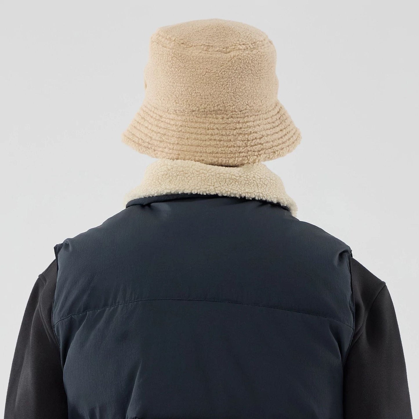 The Male model is wearing New Era Organic Boa Neck Navy Gilet 8