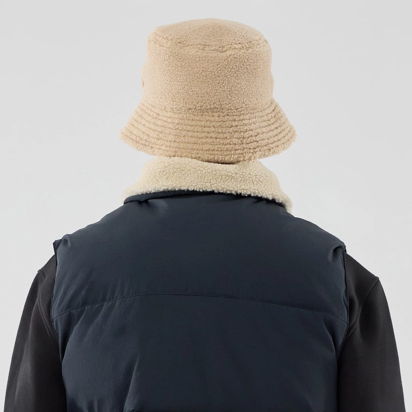 The Male model is wearing New Era Organic Boa Neck Navy Gilet 8