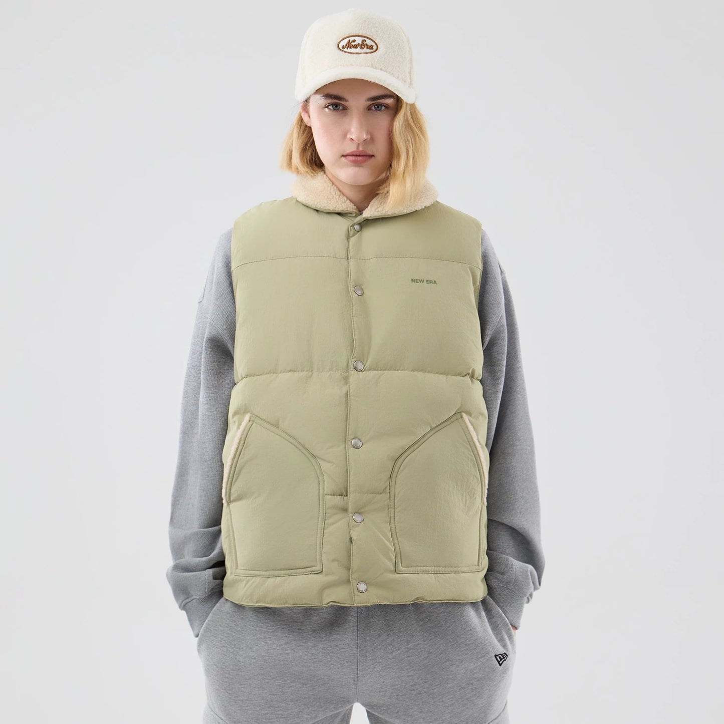 The Male model is wearing New Era Organic Boa Neck Khaki Gilet 8