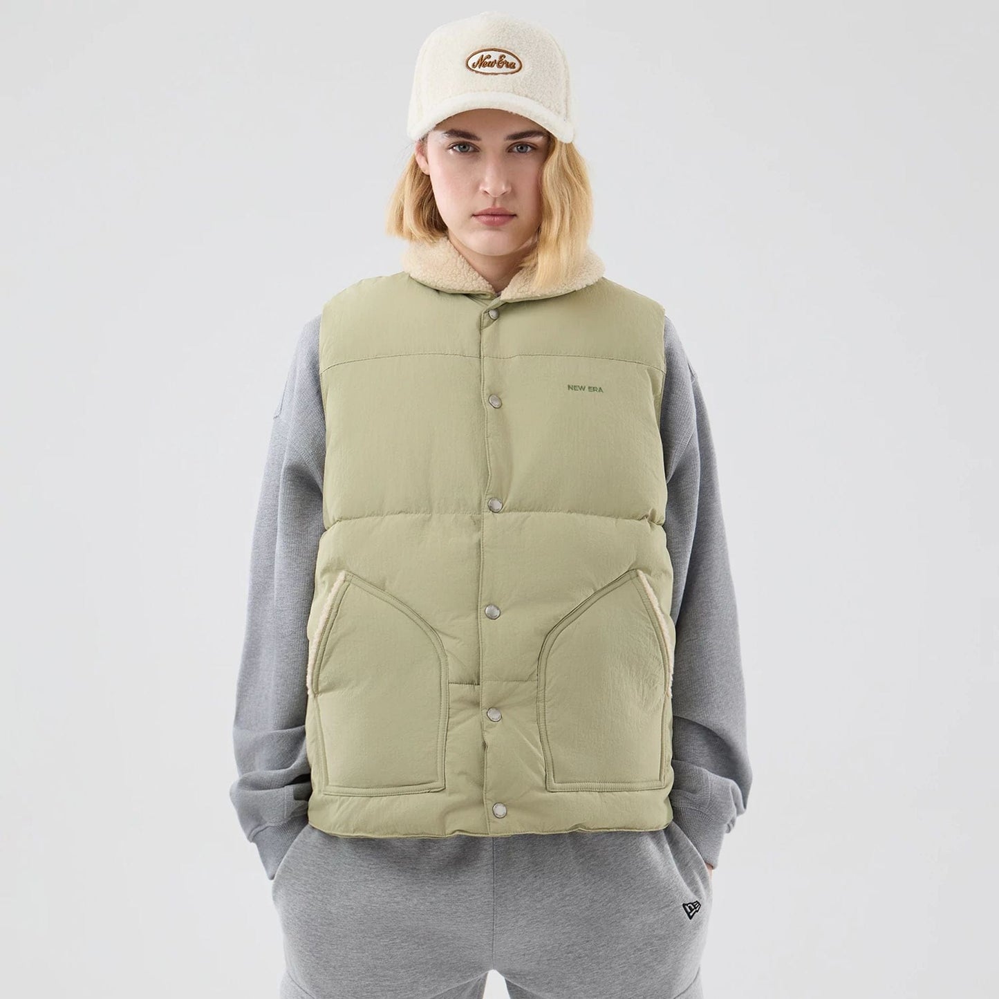 The Male model is wearing New Era Organic Boa Neck Khaki Gilet 8