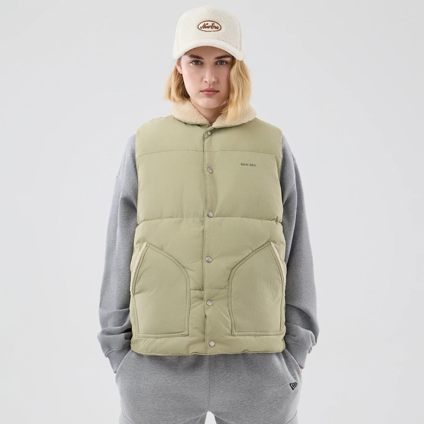 The Male model is wearing New Era Organic Boa Neck Khaki Gilet 8