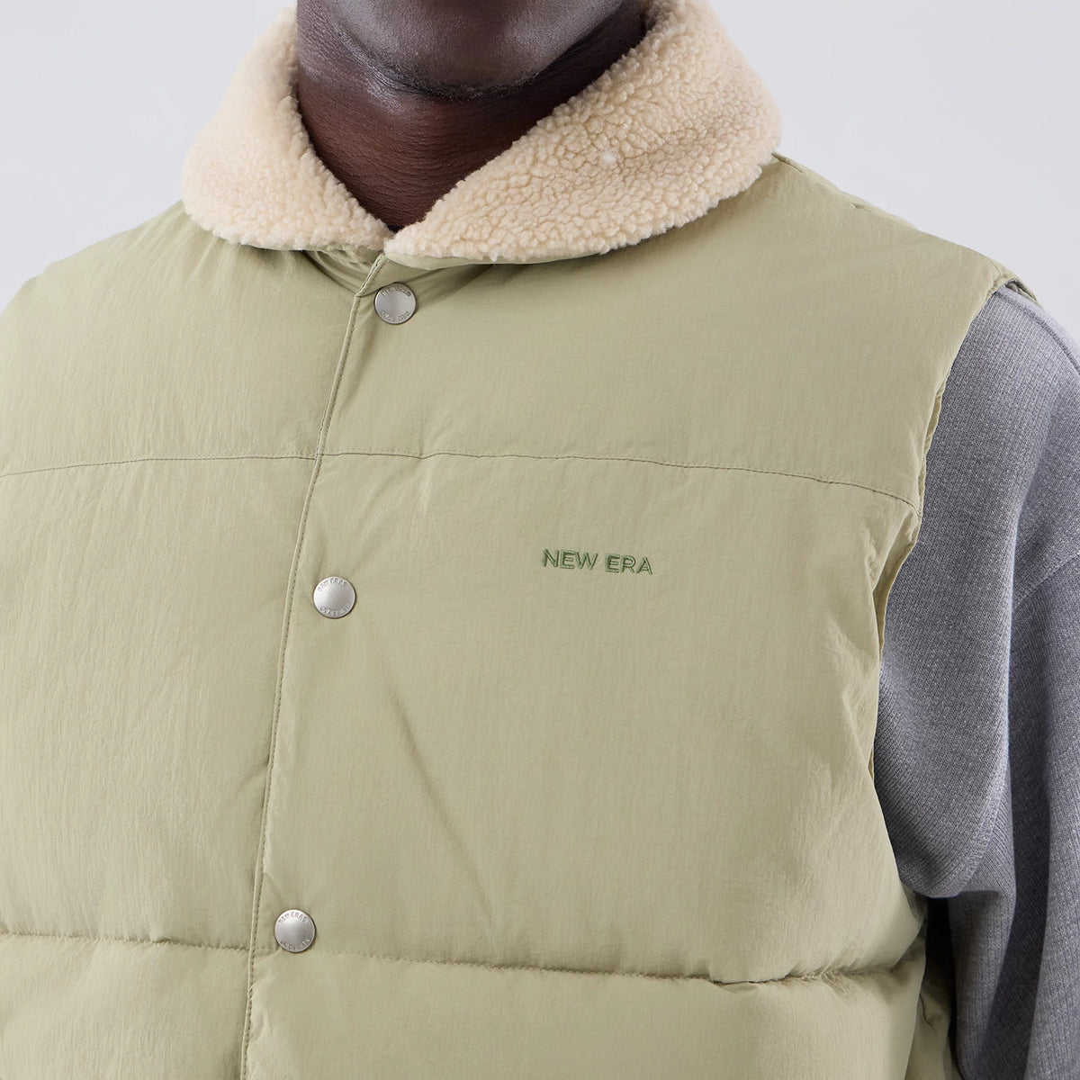 The Male model is wearing New Era Organic Boa Neck Khaki Gilet 4