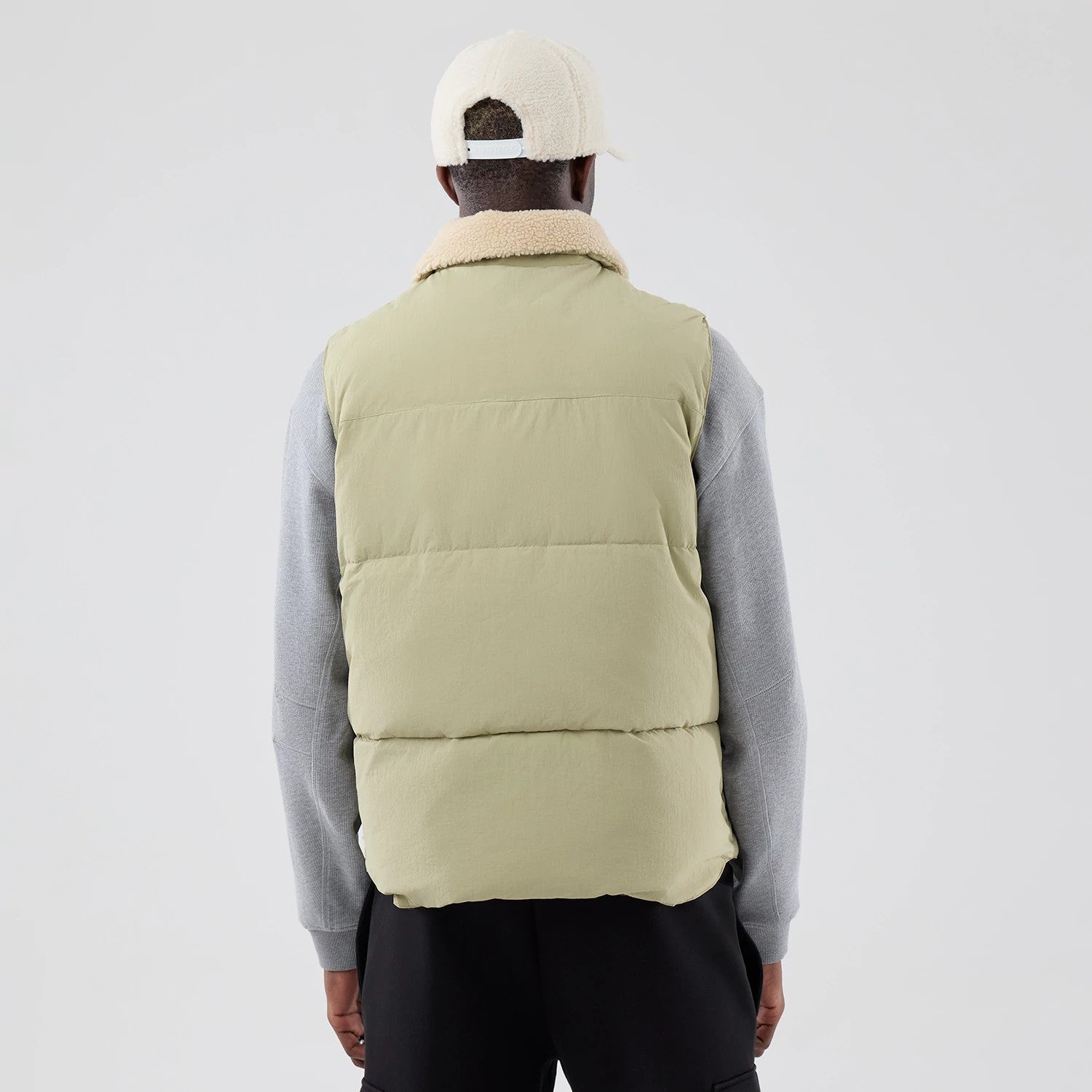The Male model is wearing New Era Organic Boa Neck Khaki Gilet 2