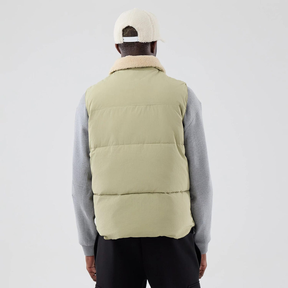 The Male model is wearing New Era Organic Boa Neck Khaki Gilet 2
