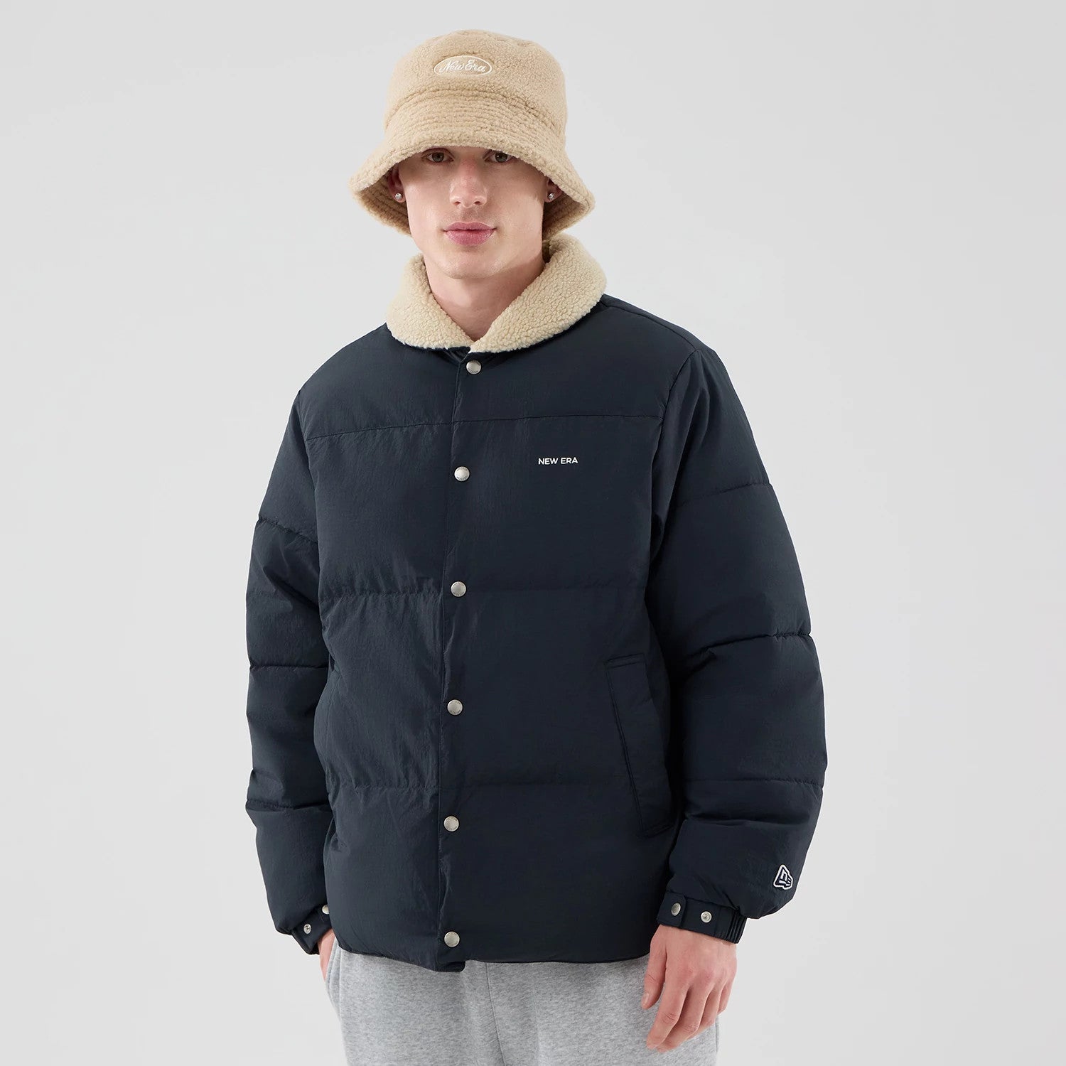 The Male model is wearing New Era Organic Boa Neck Navy Jacket 3