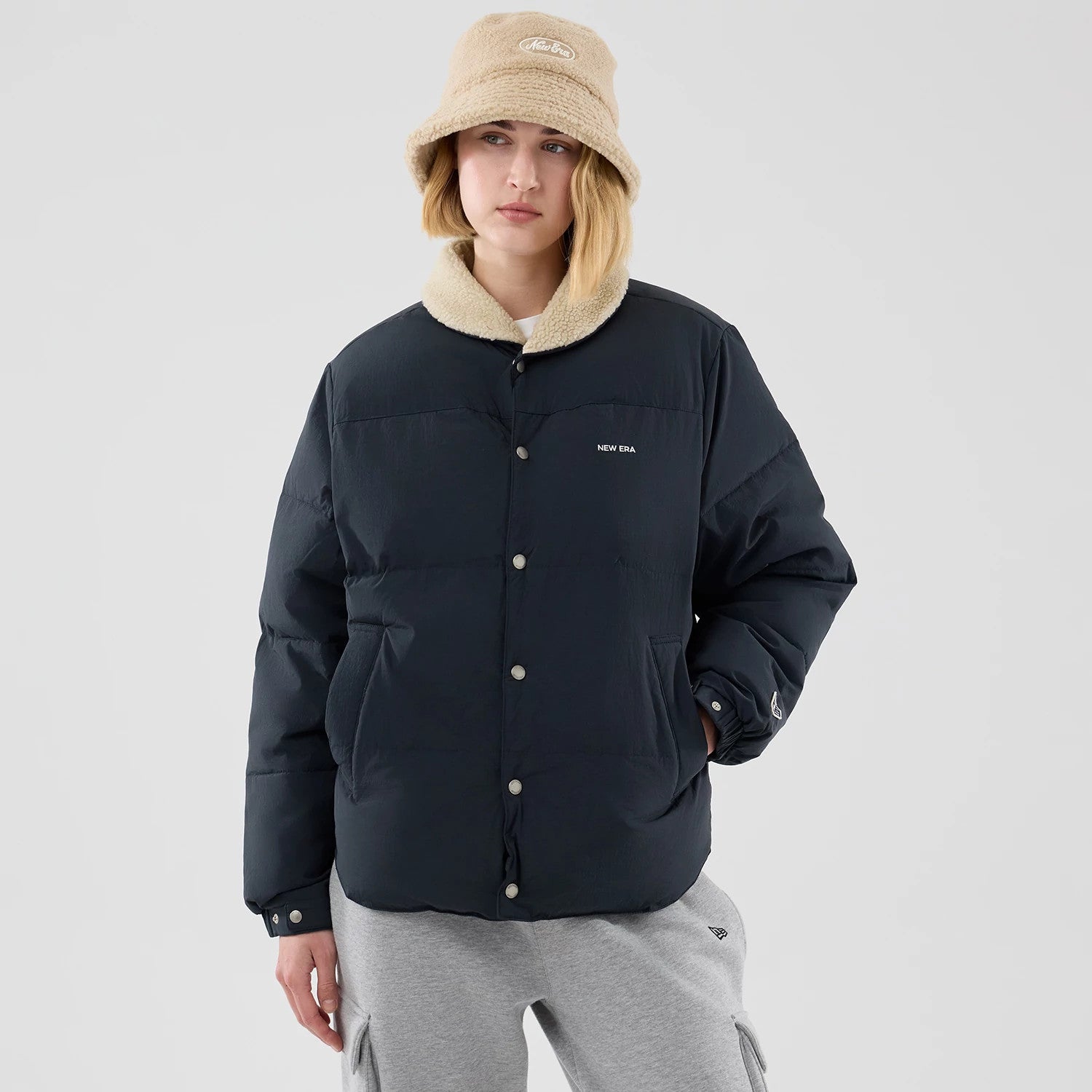 The Male model is wearing New Era Organic Boa Neck Navy Jacket 4