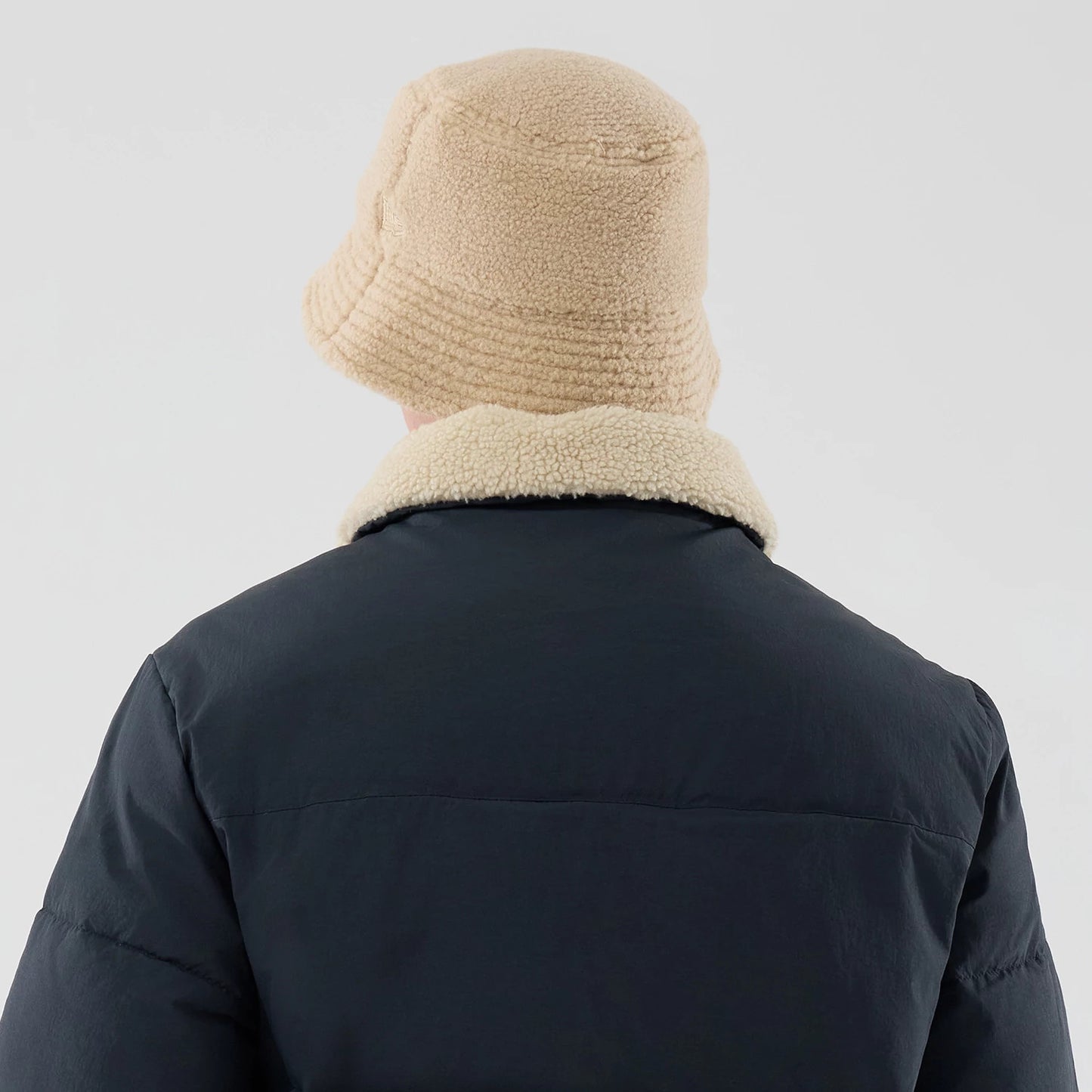 The Male model is wearing New Era Organic Boa Neck Navy Jacket 8