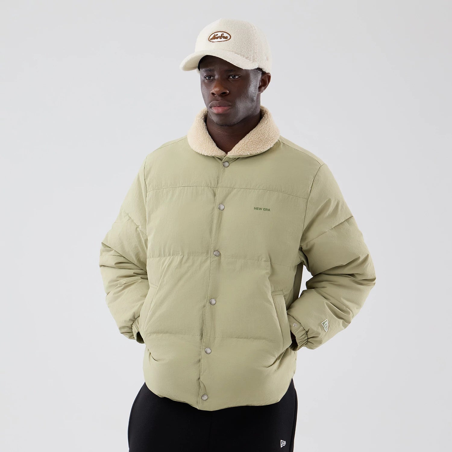 The Male model is wearing New Era Organic Boa Neck Khaki Jacket 3