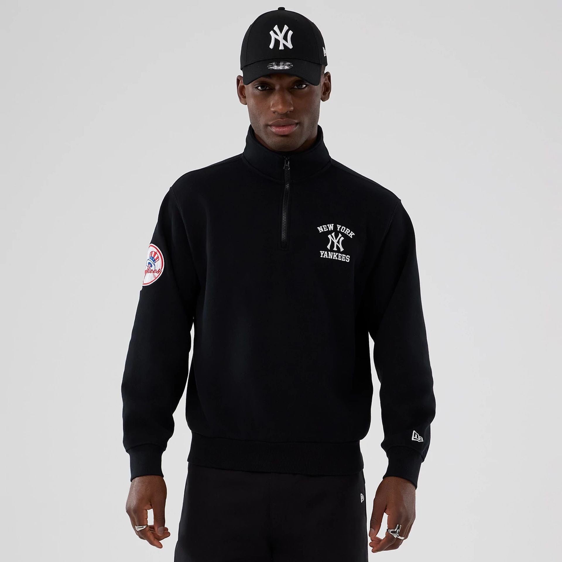 The Male model is wearing New York Yankees MLB Black 1/4 Zip Sweater 1