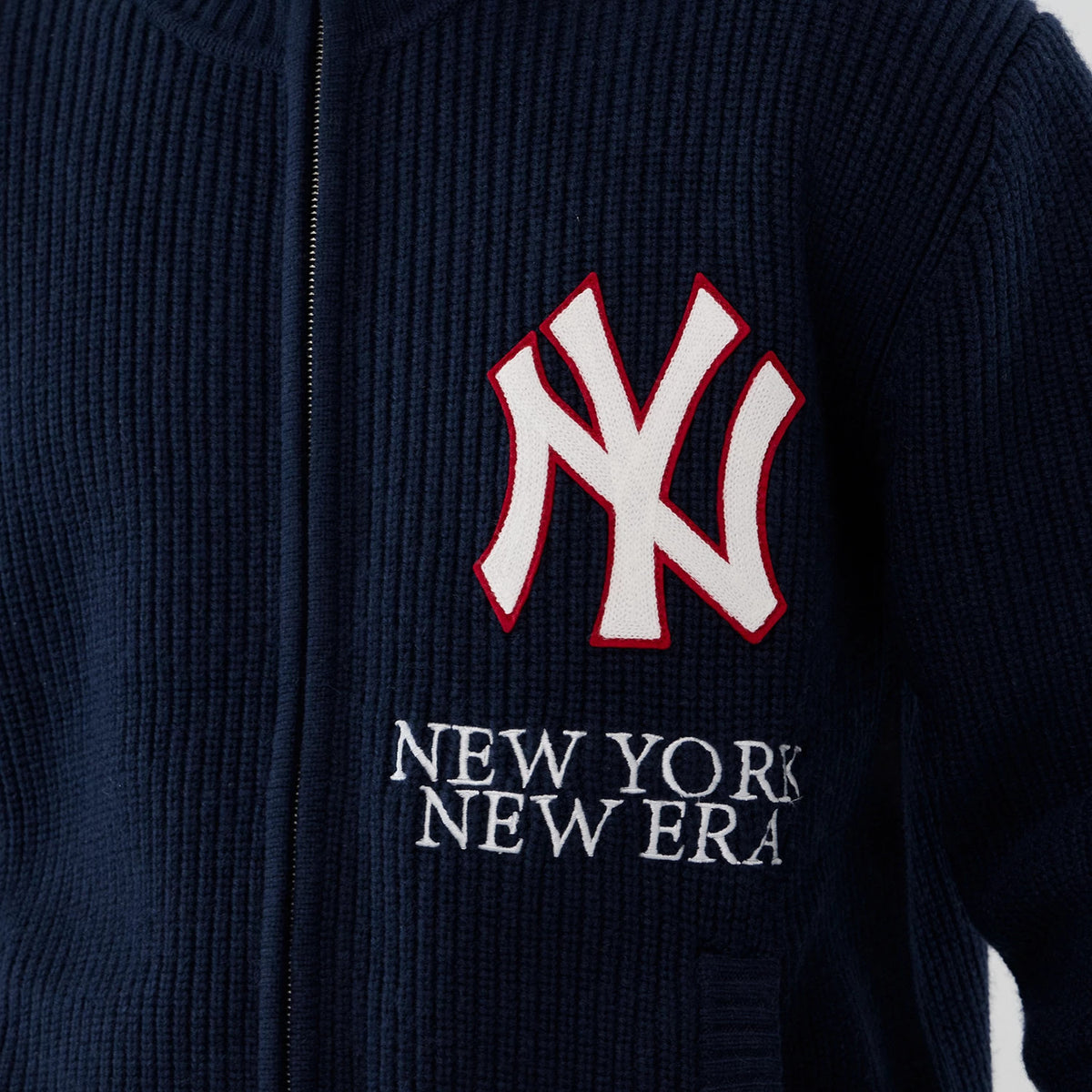 New York Yankees MLB Navy Cardigan, close-up view showing the large white and red embroidered NY logo on the left chest, with New York New Era embroidered in white below on the ribbed navy fabric.