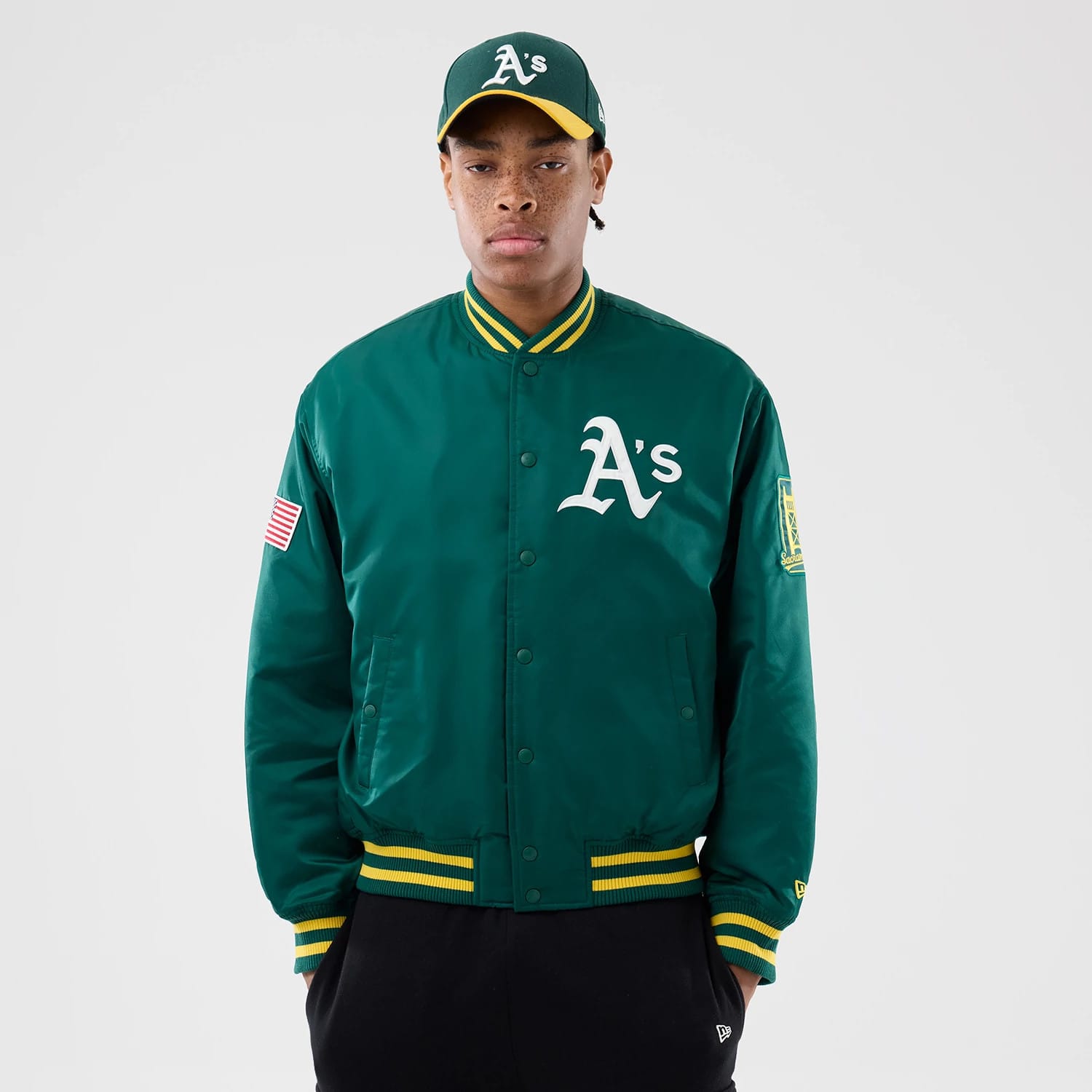 The Male model is wearing Athletics MLB Authentic Green Stadium Jacket 1
