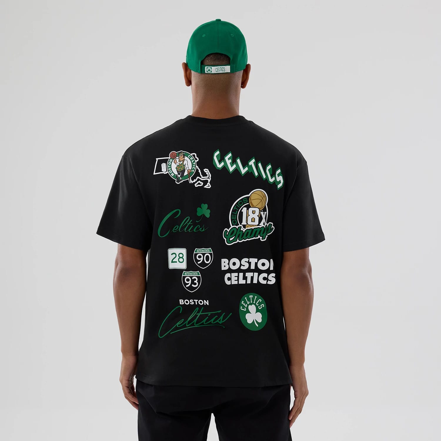 Boston Celtics NBA Logo Black T-Shirt, rear view showing multiple printed designs including team logos, the word 'Celtics', a clover, and numbers related to championship wins, all set on a plain black background.