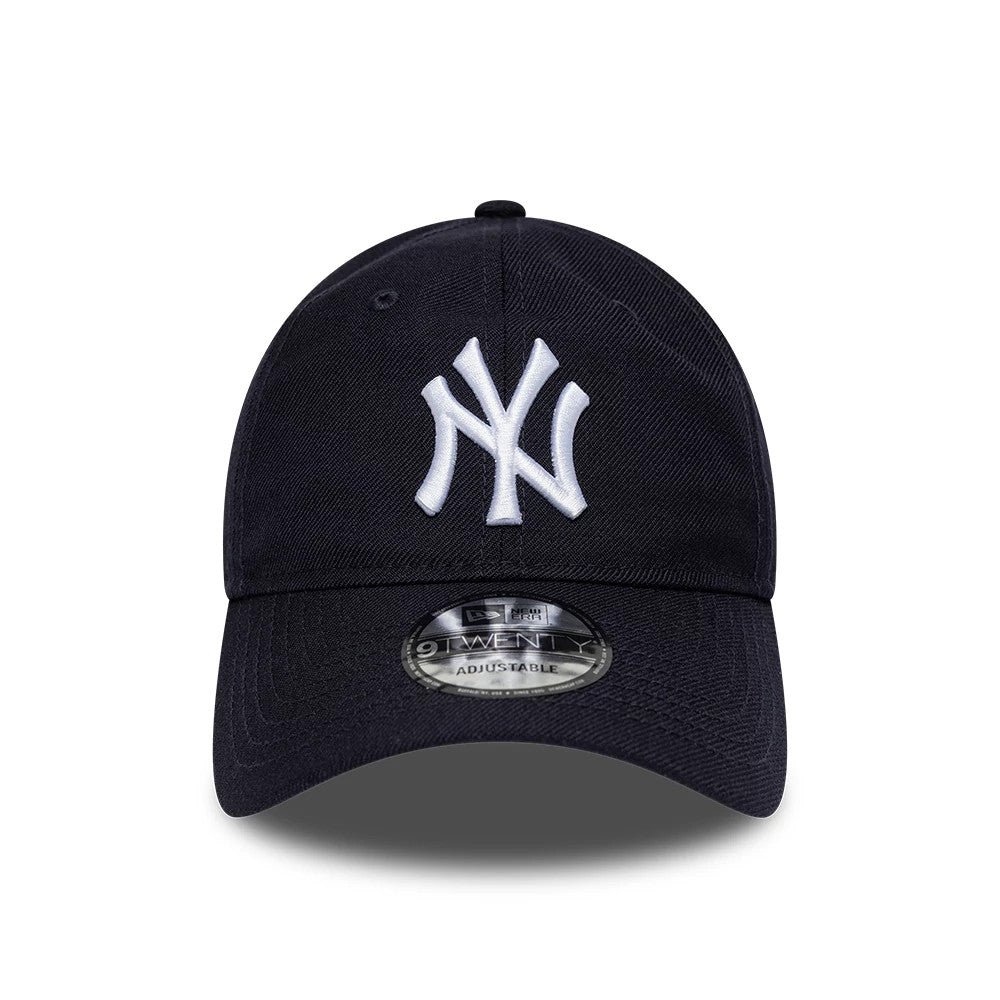 New York Yankees MLB Wool Navy New Era 9TWENTY Adjustable Cap, front view showing a raised white embroidered NY logo on the front panel, with a curved visor and a 9TWENTY size sticker on top of the visor.