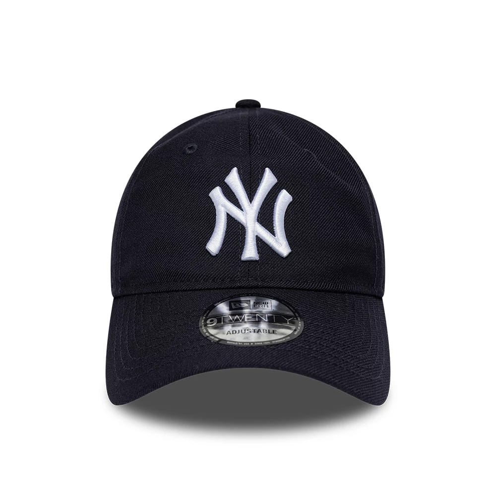New York Yankees MLB Wool Navy New Era 9TWENTY Adjustable Cap, front view showing a raised white embroidered NY logo on the front panel, with a curved visor and a 9TWENTY size sticker on top of the visor.