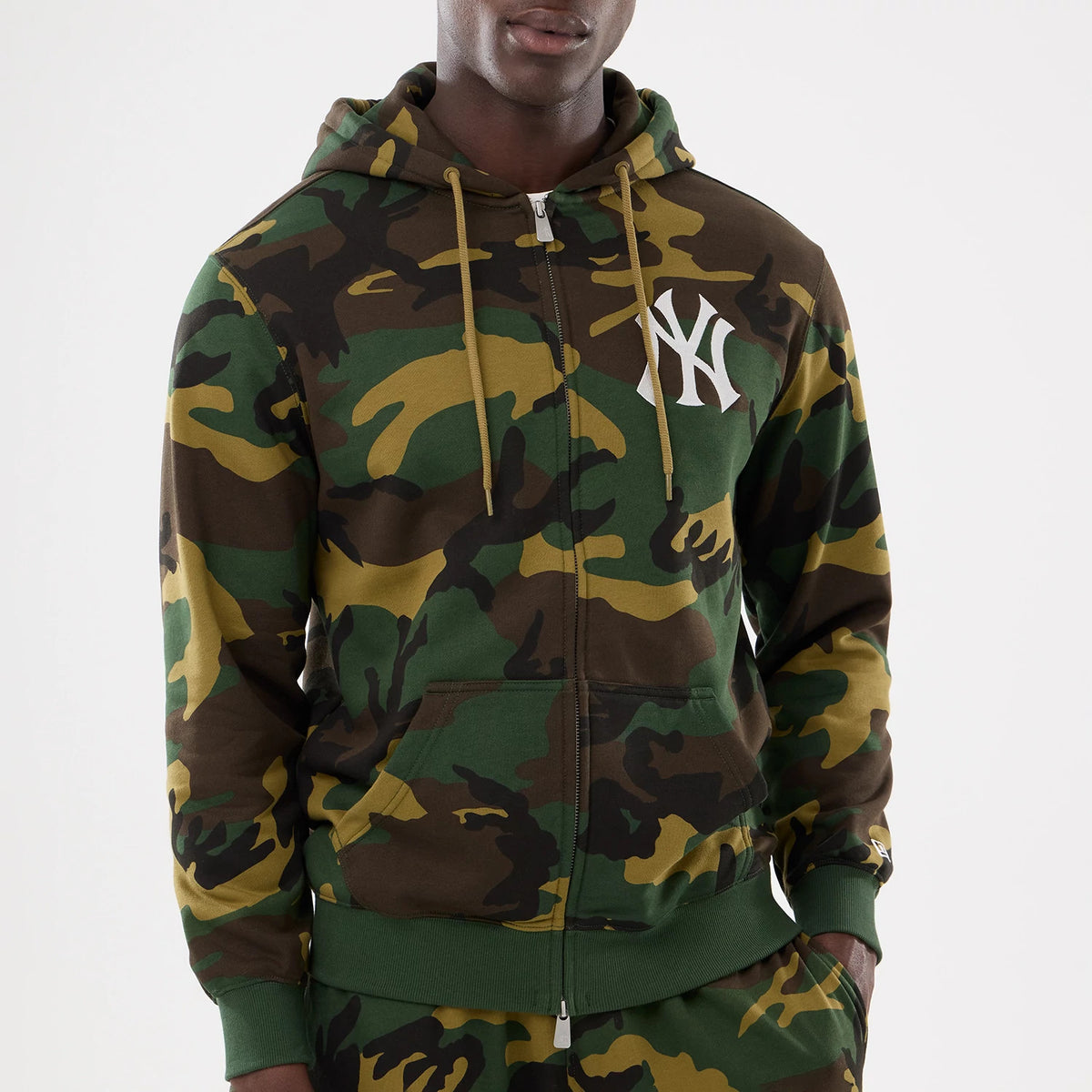 New York Yankees MLB Woodland Camo 2 Way Full Zip Hoodie, front view showing the green and brown camo pattern with a white raised New York Yankees logo on the left chest and an adjustable drawstring hood.