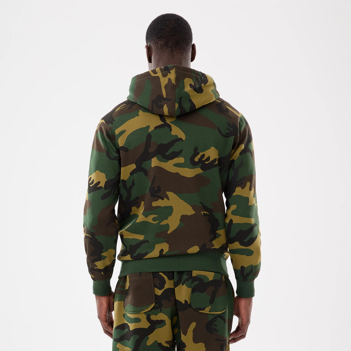New York Yankees MLB Woodland Camo 2 Way Full Zip Hoodie, rear view showing the green and brown camouflage pattern across the hood and sleeves, ribbed cuffs at the wrists, and the back of the hoodie extending to the waistband.