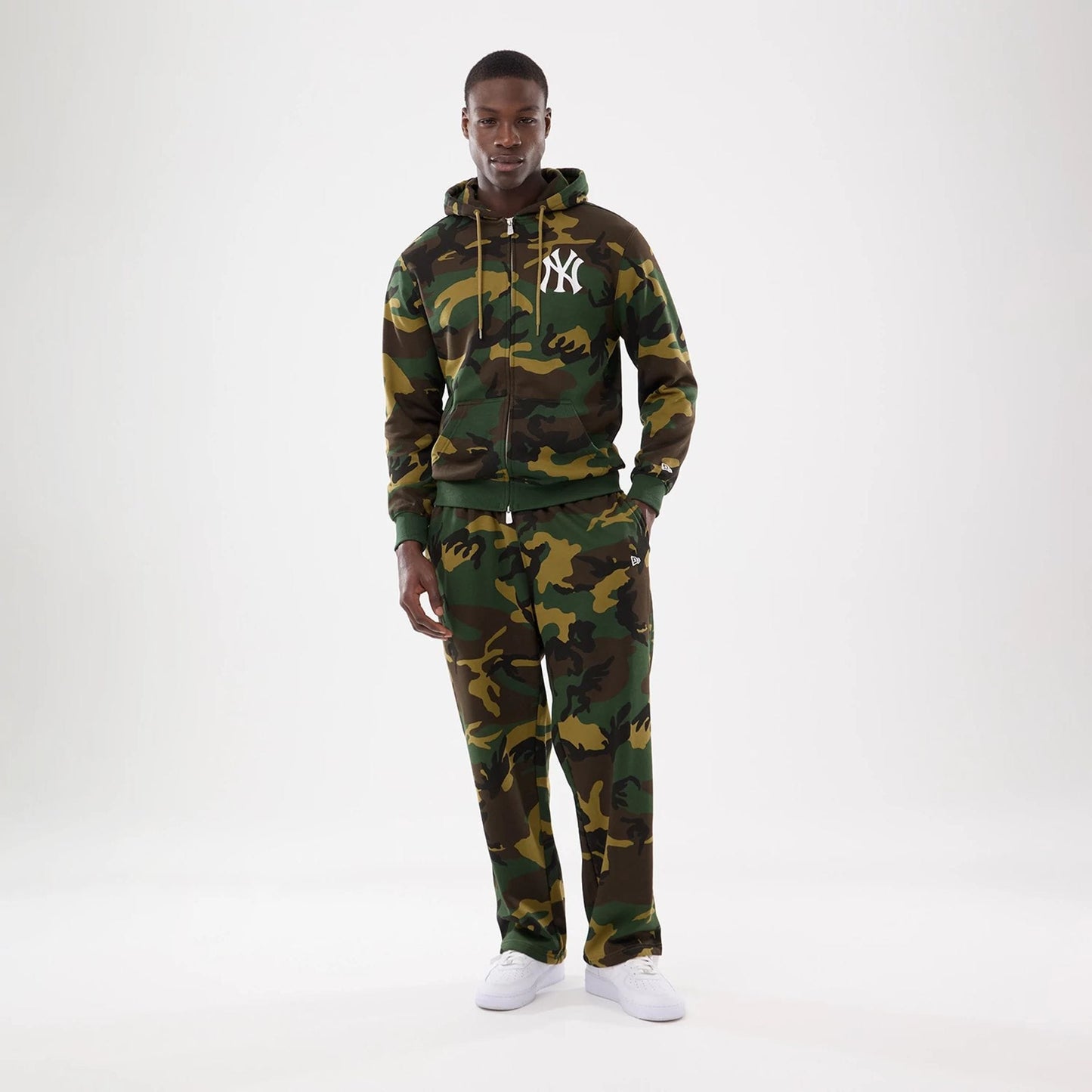 The model is wearing this MLB Camo New York Yankees 2 Way Full Zip Hoodie in Woodland Camo. 8