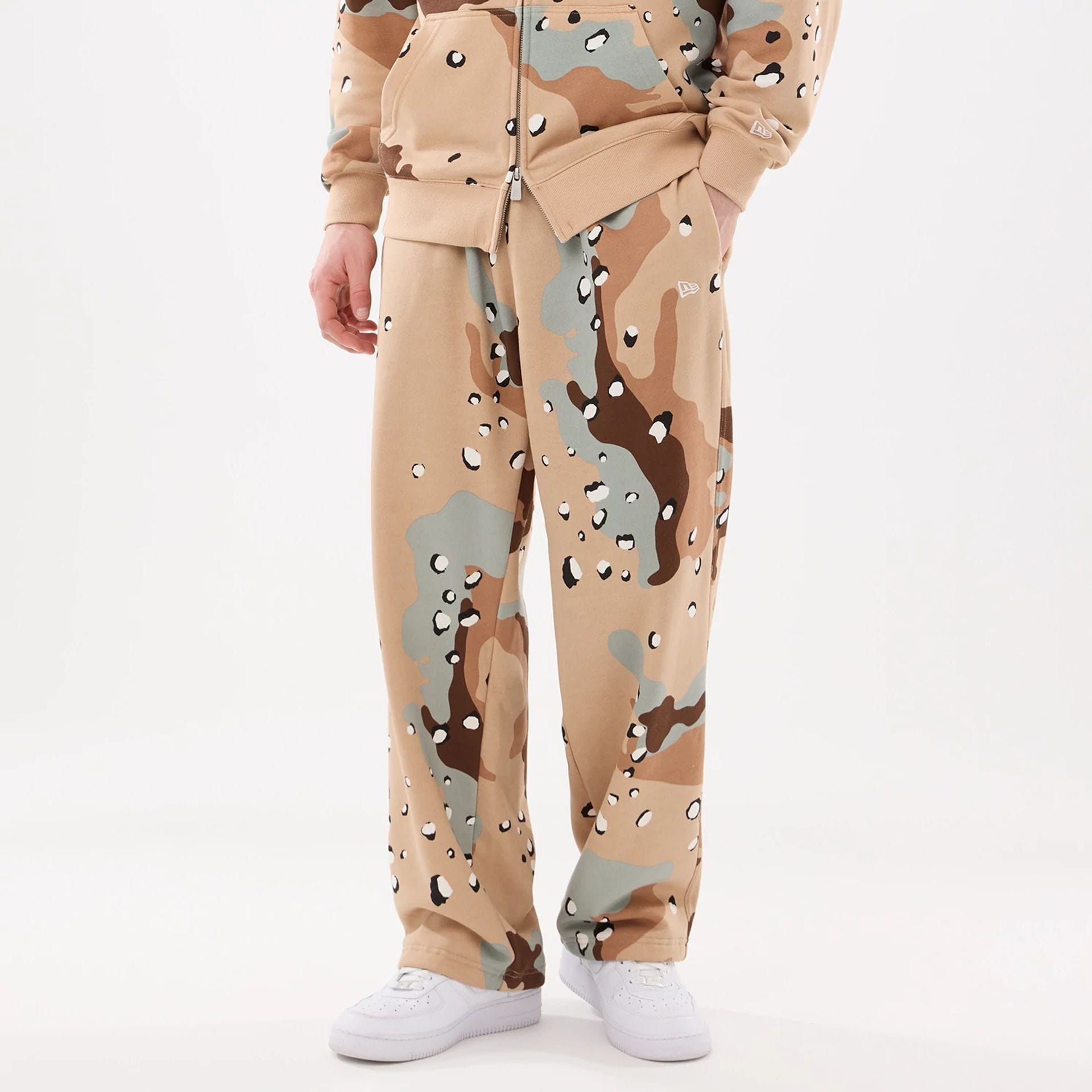 The model is wearing these New Era Desert Camo Joggers. 1