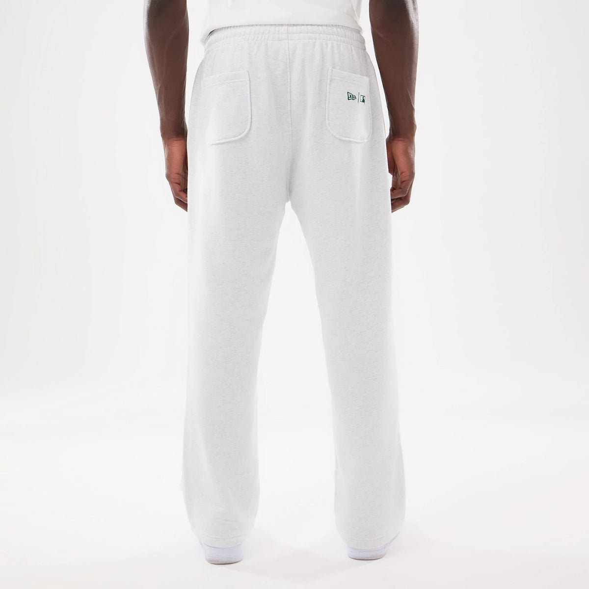 LA Dodgers MLB Comfort Grey Joggers, rear view on a model with two back pockets and a green embroidered New Era flag logo on the right pocket, featuring an elasticated waistband for a relaxed fit.