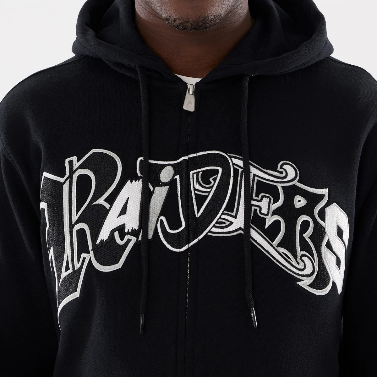 Las Vegas Raiders NFL Word Art Black 2 Way Full Zip Hoodie, front view showing the white and black embroidered "Raiders" word art across the chest, hood with drawstrings, and full zip closure down the centre.