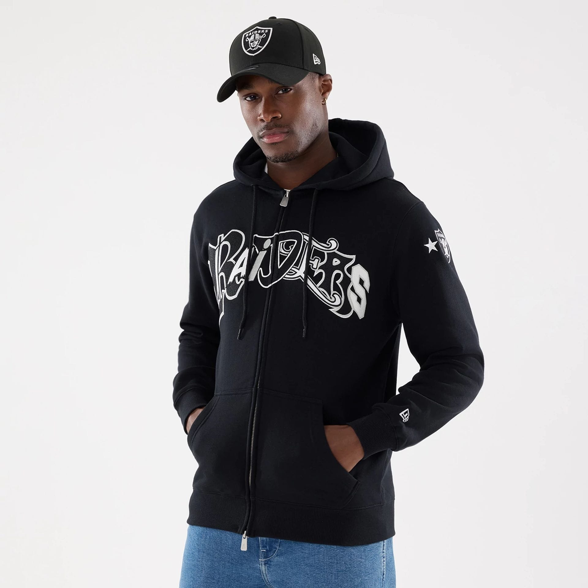 The model is wearing this MLB Word Art Las Vegas Raiders 2 Way Full Zip Hoodie in black. 1