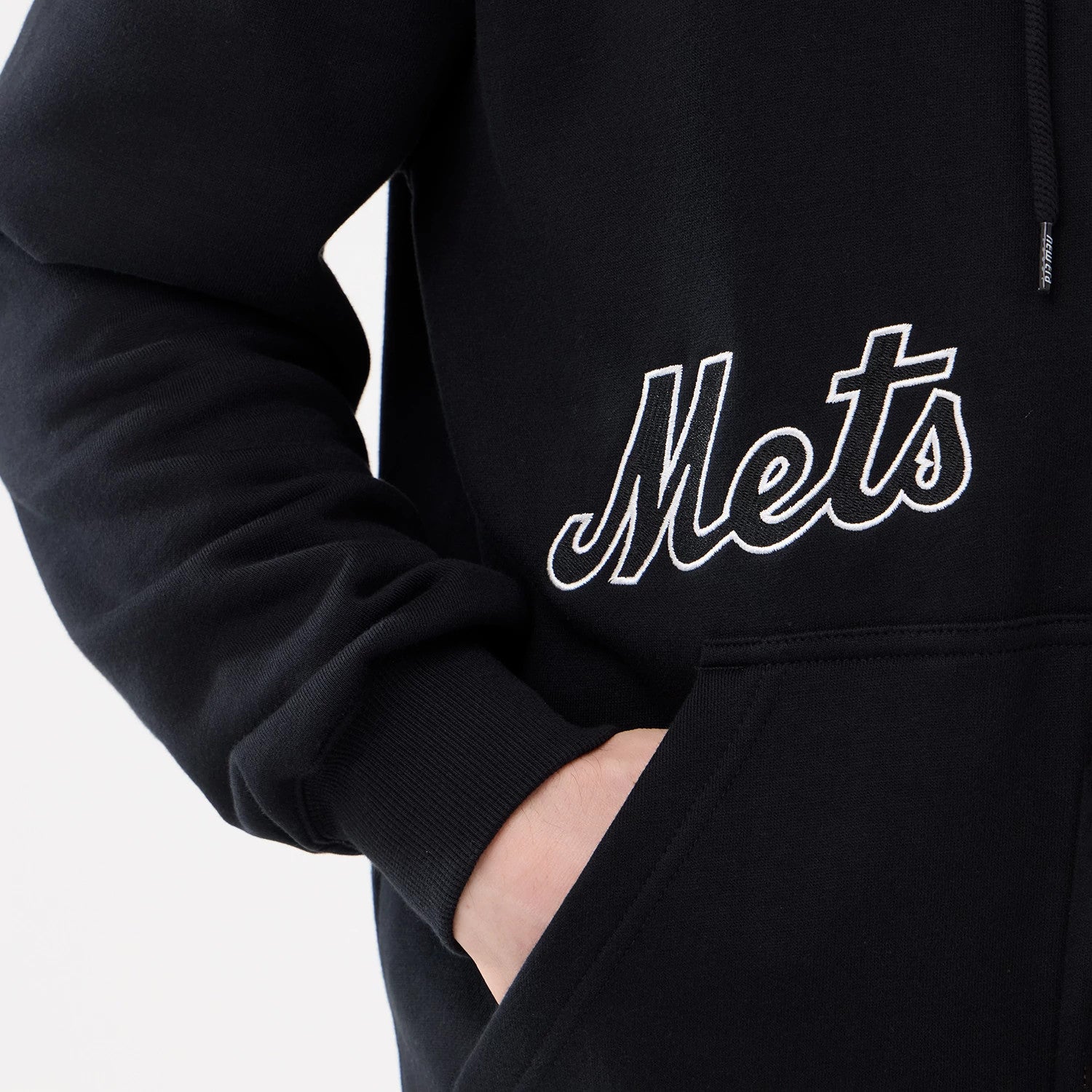 The model is wearing this MLB Comfort New York Mets 2 Way Full Zip Hoodie in black. 4