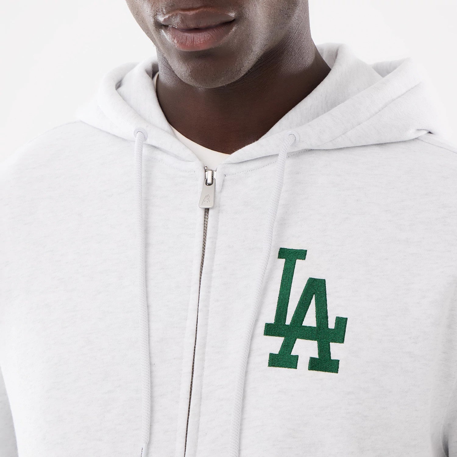 The model is wearing this MLB Comfort LA Dodgers 2 Way Full Zip Hoodie in grey. 3