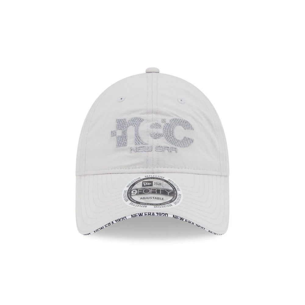 New Era NEC Logo Grey New Era 9FORTY Unstructured Adjustable Cap, front view showing a grey embroidered n + C and New Era logo on the front panels, with a 9FORTY size sticker on the curved visor.