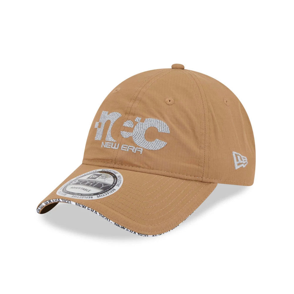 New Era NEC Logo Beige New Era 9FORTY Unstructured Adjustable Cap, three-quarter view with large white embroidered NEC logo on the front panel, New Era flag logo on the left side, and 9FORTY size sticker on the beige visor.