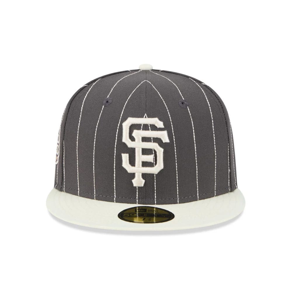 San Francisco Giants MLB Stripes Dark Grey New Era 59FIFTY Fitted Cap, front view with white pinstripes and raised white embroidered SF logo on the crown, flat cream visor featuring a gold 59FIFTY size sticker.
