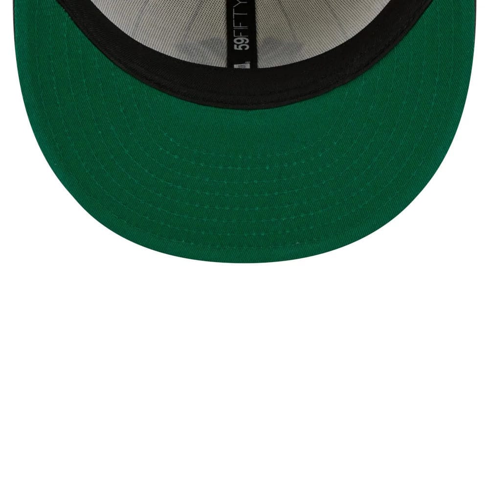 New York Yankees MLB Stripes Cream & Black New Era 59FIFTY Fitted Cap, inside view showing black taping with 59FIFTY branding on the crown and a green undervisor beneath the black visor.