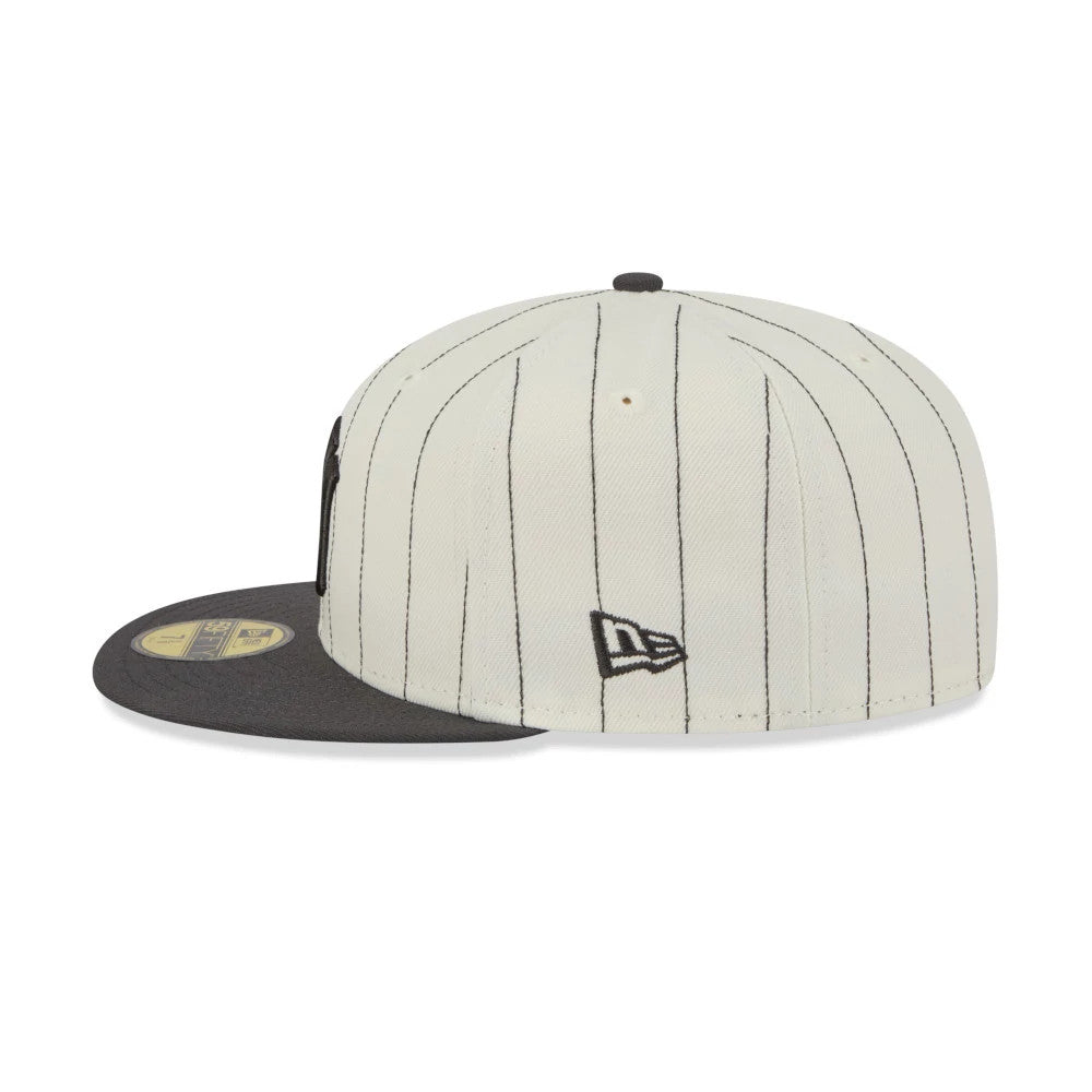 New York Yankees MLB Stripes Cream & Black New Era 59FIFTY Fitted Cap, side view showing the embroidered black New Era flag logo on the left side, with thin black vertical stripes on the cream crown and a black visor with a gold 59FIFTY size sticker.