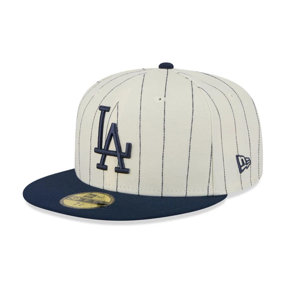LA Dodgers MLB Stripes Cream New Era 59FIFTY Fitted Cap, three-quarter view showing raised navy LA logo on the striped front panel, navy flat visor with gold 59FIFTY size sticker, and New Era flag logo on the left side.