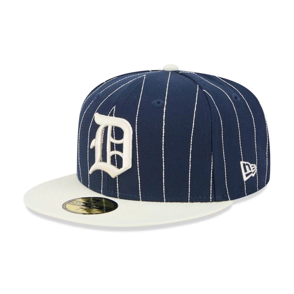 Detroit Tigers MLB Stripes Dark Blue New Era 59FIFTY Fitted Cap, three-quarter view showing the white embroidered D logo on the front panel, a cream flat visor with gold 59FIFTY size sticker, and white pinstripes on the dark blue crown.