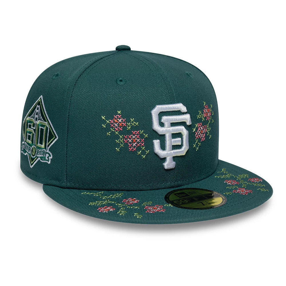 San Francisco Giants MLB Garden Dark Green New Era 59FIFTY Fitted Cap, front view showing raised white SF logo with floral embroidery in red and yellow on the front panel and visor, alongside a 60th anniversary side patch.
