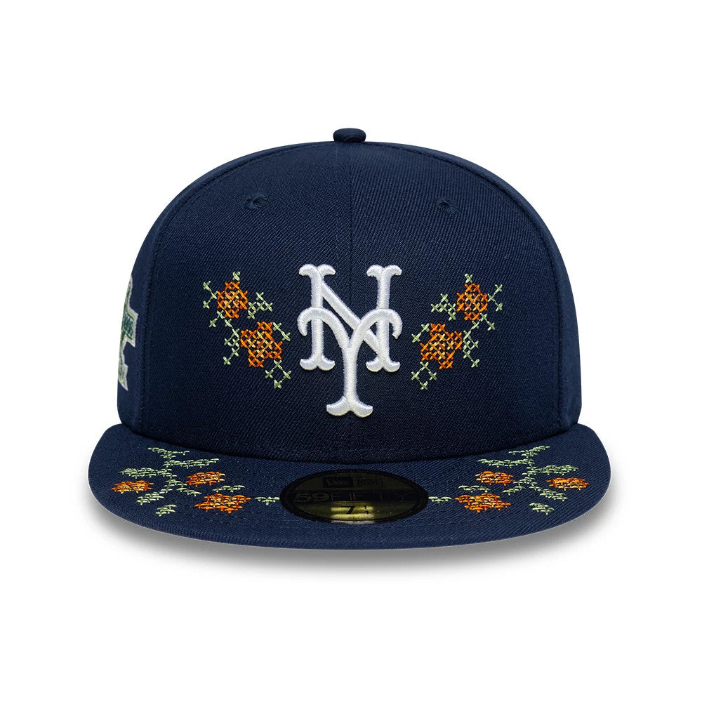 New York Mets MLB Garden Dark Blue New Era 59FIFTY Fitted Cap, front view showing white raised embroidered NY logo on a dark blue crown, floral embroidery in orange and green on visor, gold 59FIFTY size sticker.