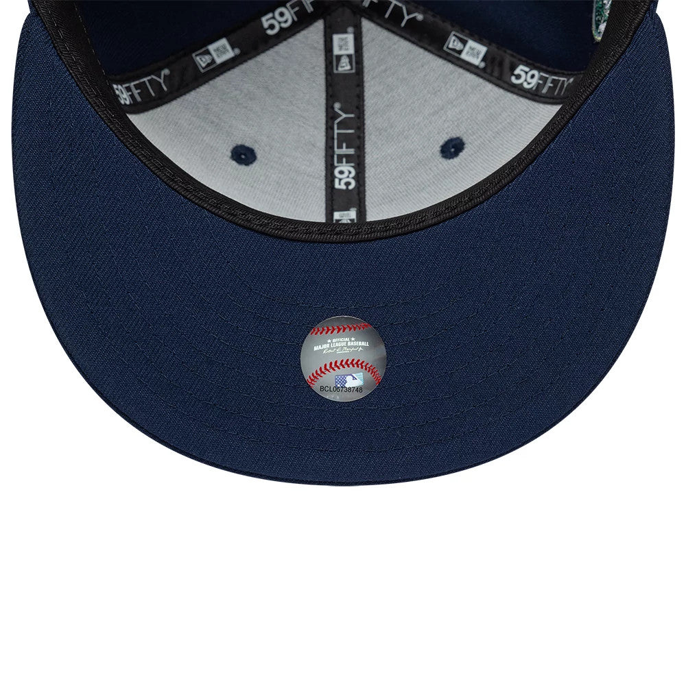 LA Dodgers MLB Garden Dark Blue New Era 59FIFTY Fitted Cap, inside view showing black taping with white 59FIFTY branding, a grey sweatband, and a sticker featuring a baseball design on the dark undervisor.