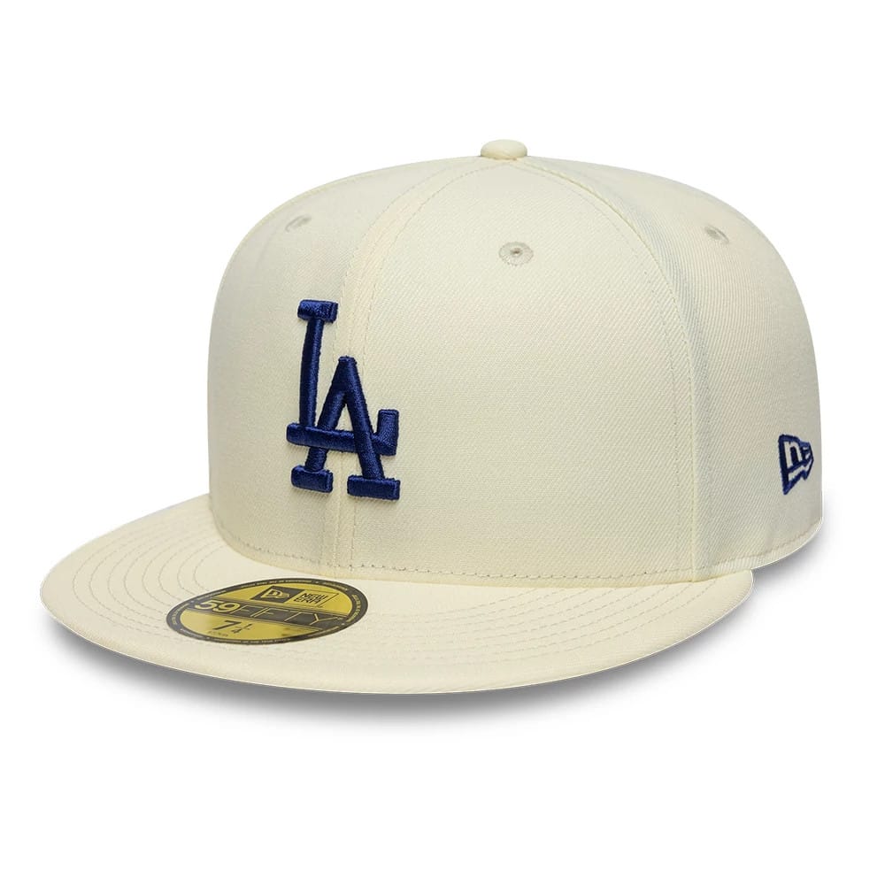 LA Dodgers MLB City Series White New Era 59FIFTY Fitted Cap, three-quarter view showing the raised blue LA logo on the front panel, flat white visor with gold 59FIFTY size sticker, and New Era flag logo on the left side.
