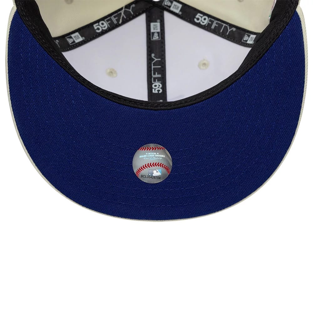 LA Dodgers MLB City Series White New Era 59FIFTY Fitted Cap, inside view showing the blue undervisor with a baseball sticker, black taping with repeated 59FIFTY branding, and white eyelets on the crown interior.