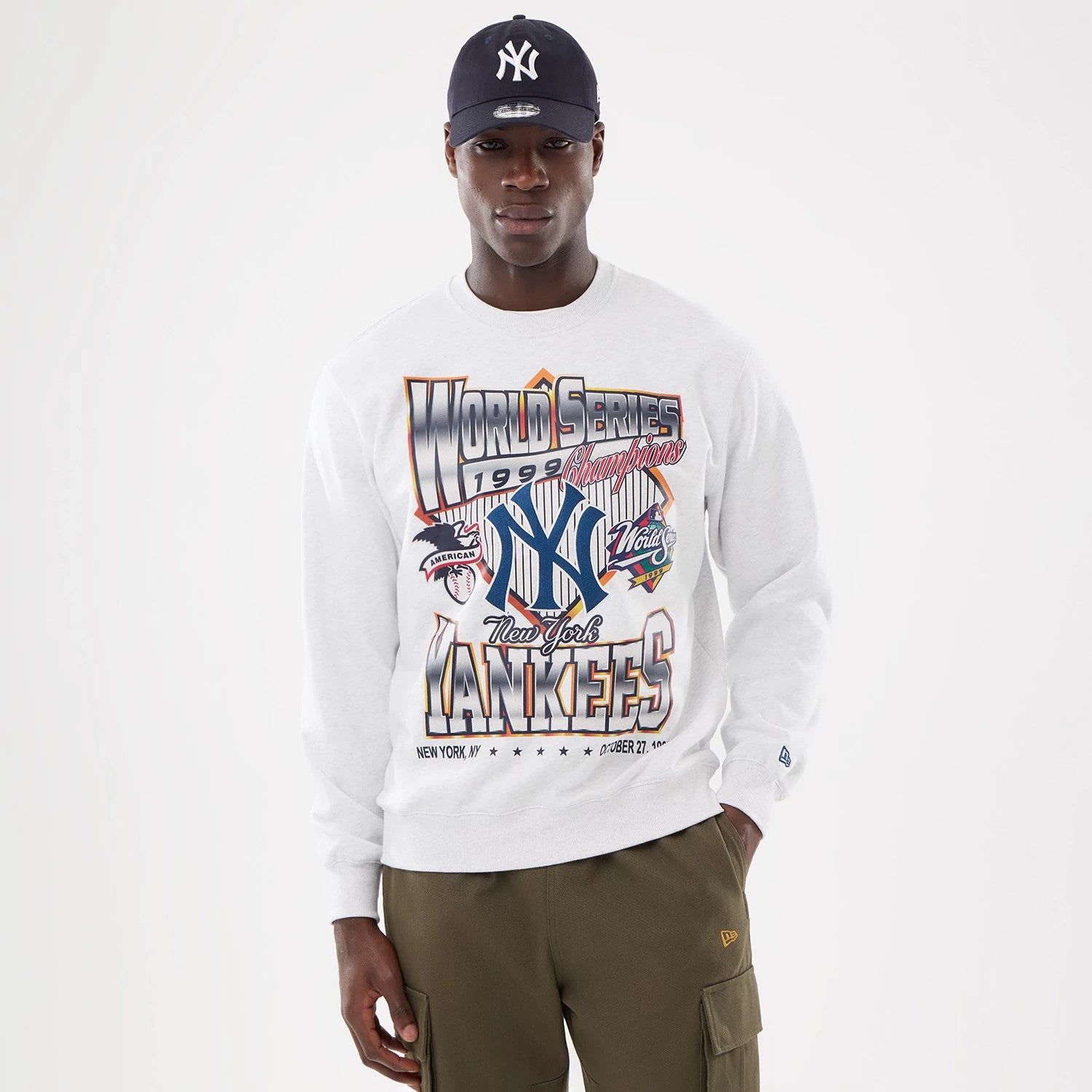 The model is wearing this MLB Retro New York Yankees Oversized Crew Neck Sweater in White 1