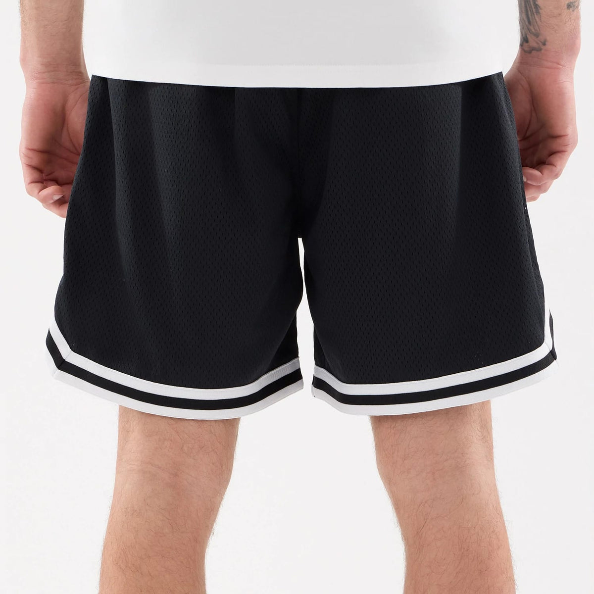 New York Mets MLB Comfort Navy Oversized Shorts, rear view showing the navy fabric with a loose fit, white and black stripes around the hem of each leg, and a plain design with no visible logos.