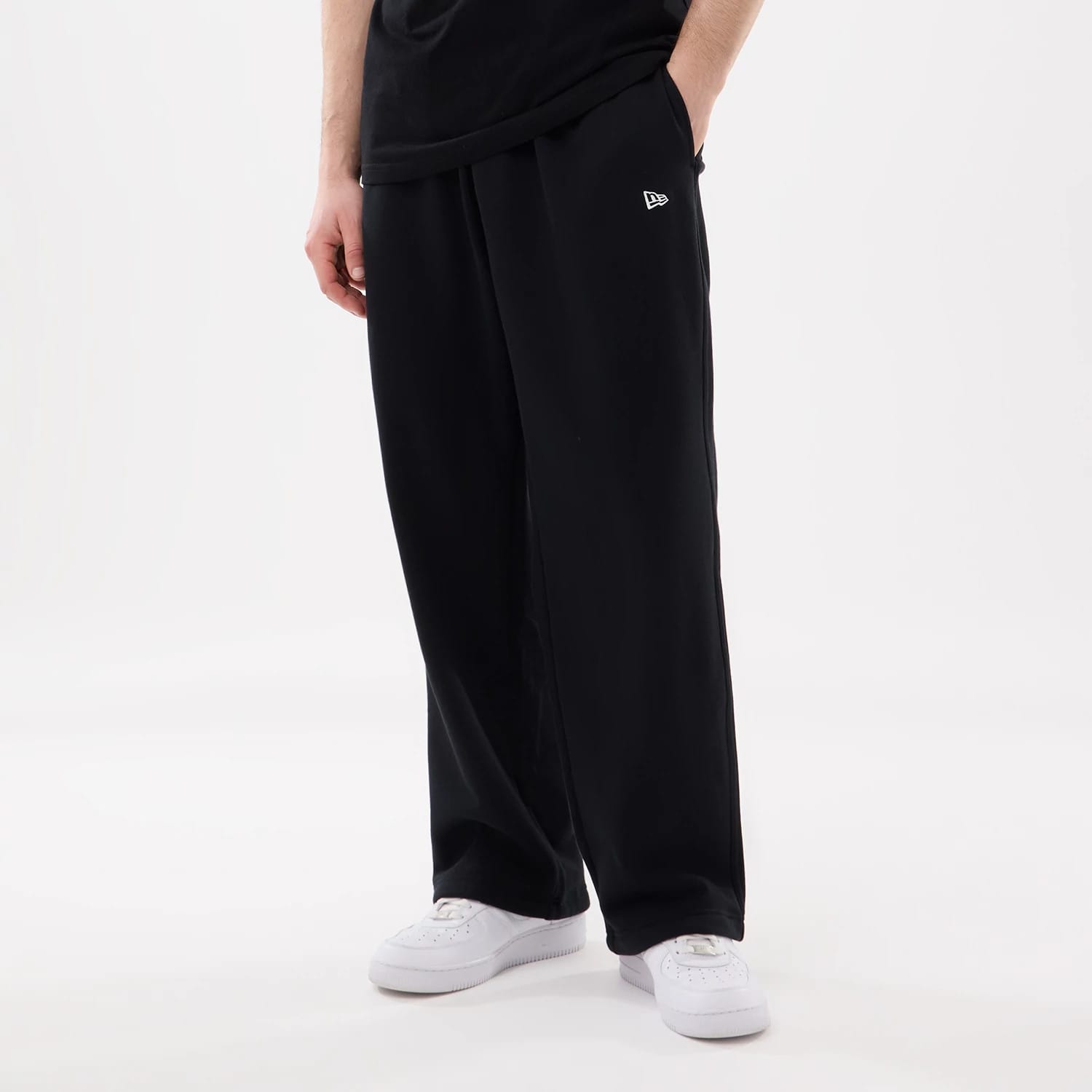 The model is wearing this New Era Straight Legged Joggers in black. 1