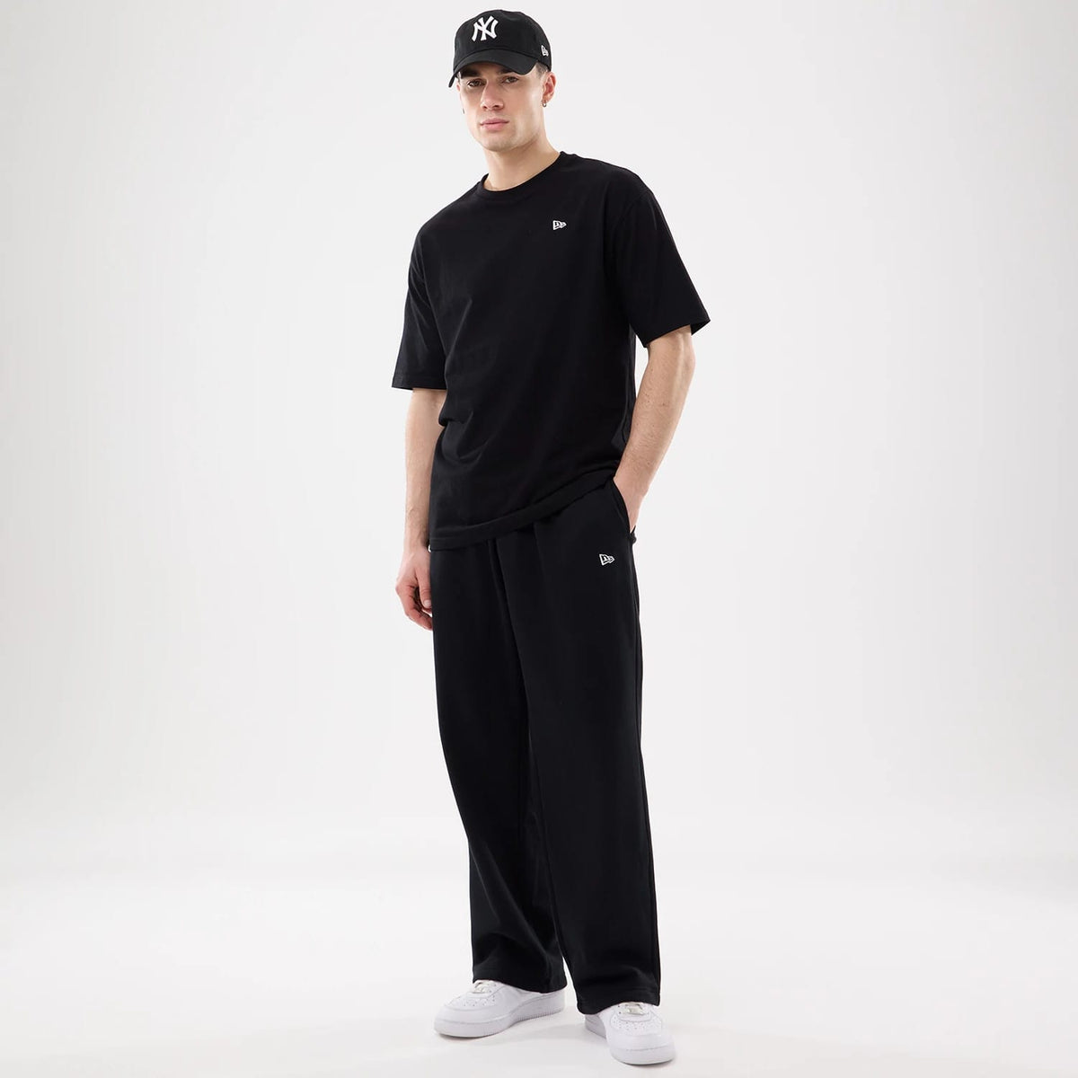 The model is wearing this New Era Straight Legged Joggers in black. 7