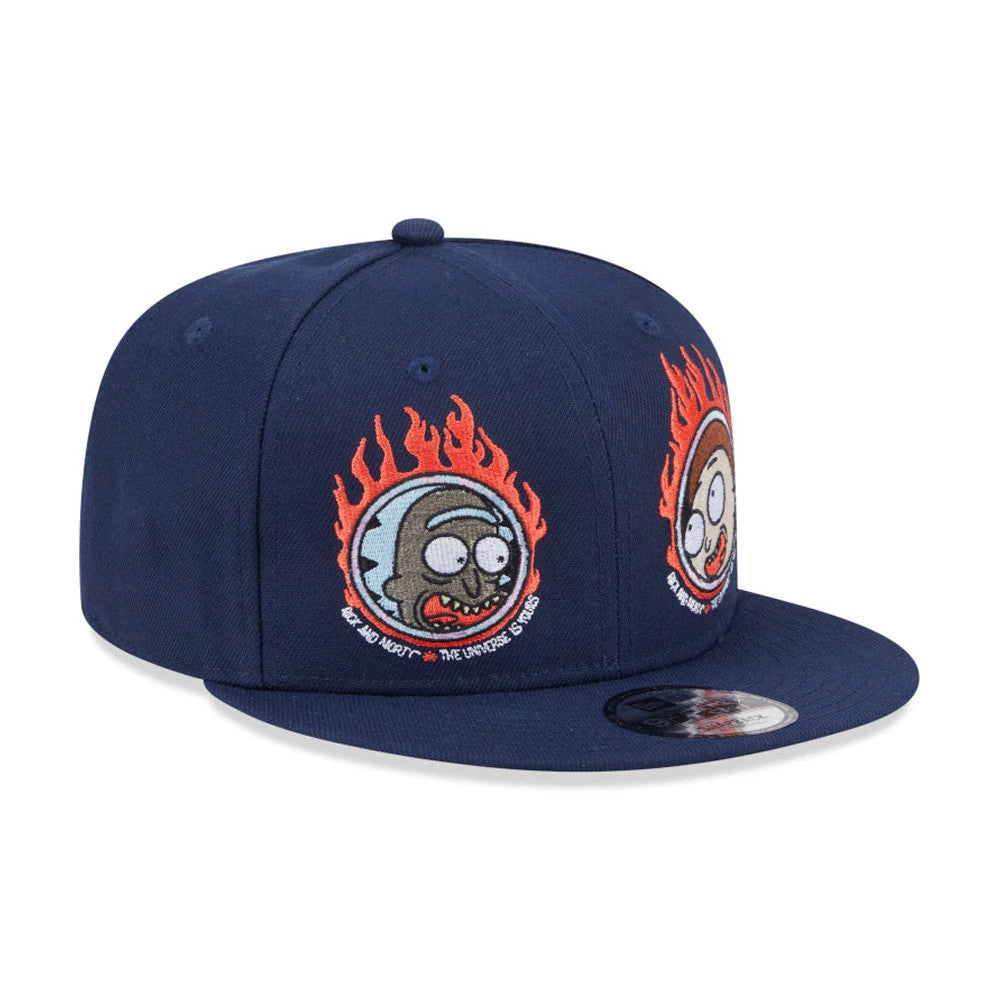 Rick And Morty Dark Blue New Era 9FIFTY Adjustable Cap, three-quarter view showing embroidered flaming Rick and Morty faces on the front panels with a flat visor and a 9FIFTY size sticker on the dark blue visor.