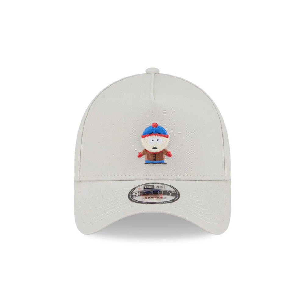 South Park Stan Marsh Beige New Era 9FORTY A-Frame Adjustable Cap, front view showing an embroidered Stan Marsh character on the front panel and a 9FORTY size sticker on the curved visor.