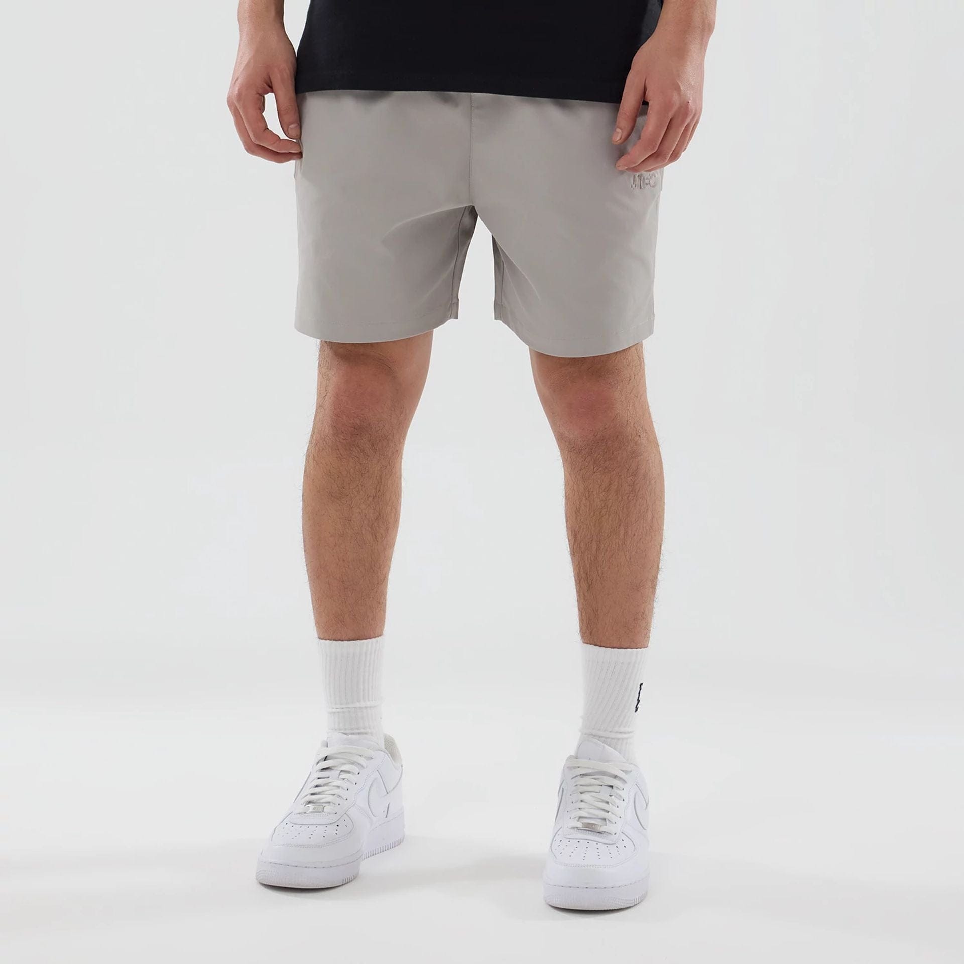 The model is wearing this New Era Urban Core Oversized Shorts in Beige . 1