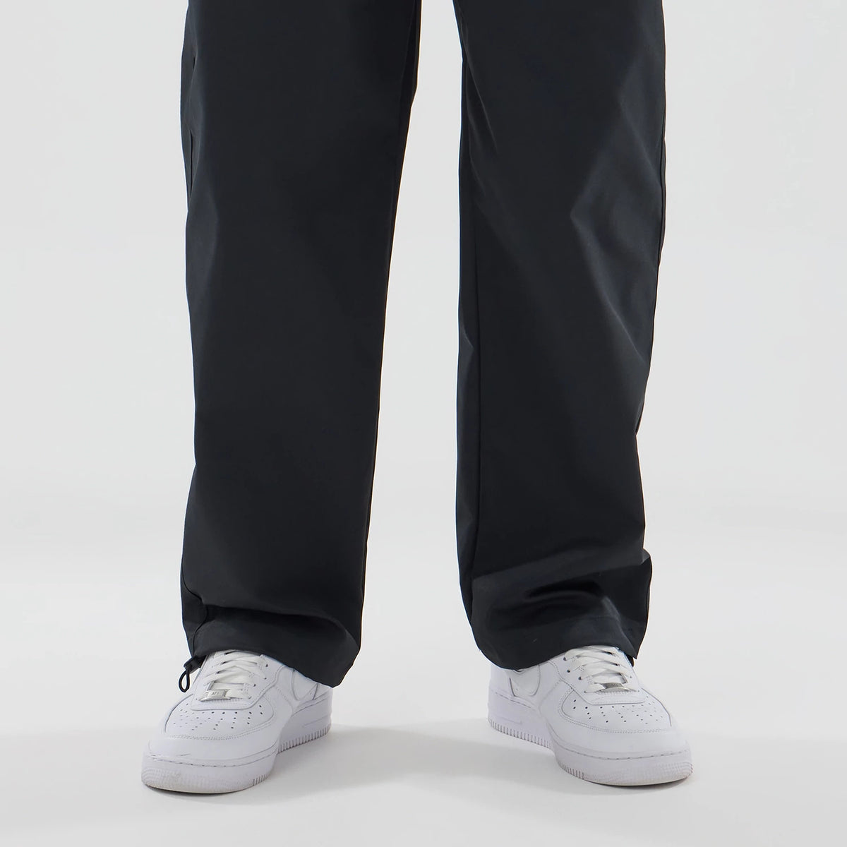 The model is wearing this New Era NEC Logo Straight Leg Joggers in black. 4