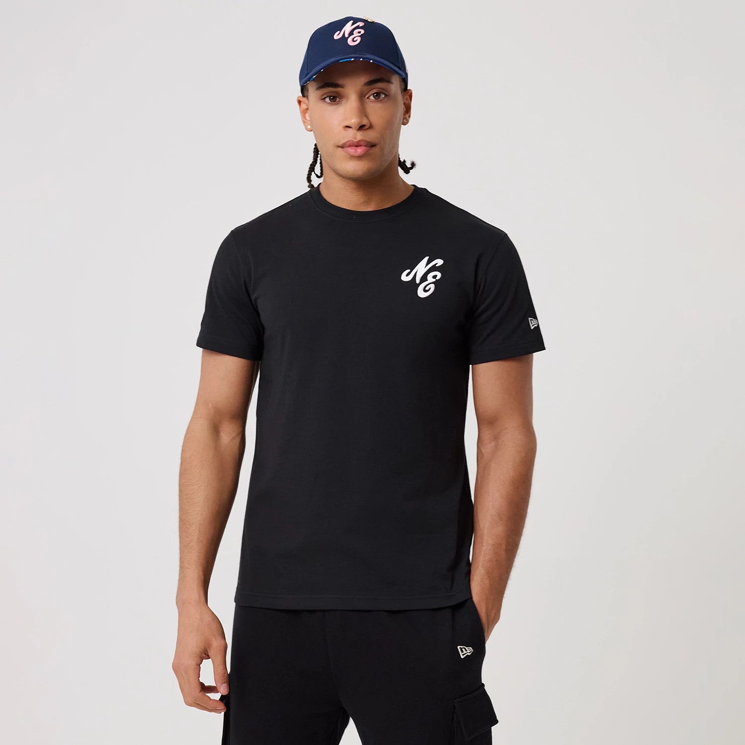 The model is wearing this New Era Sakura T-Shirt in black. 1