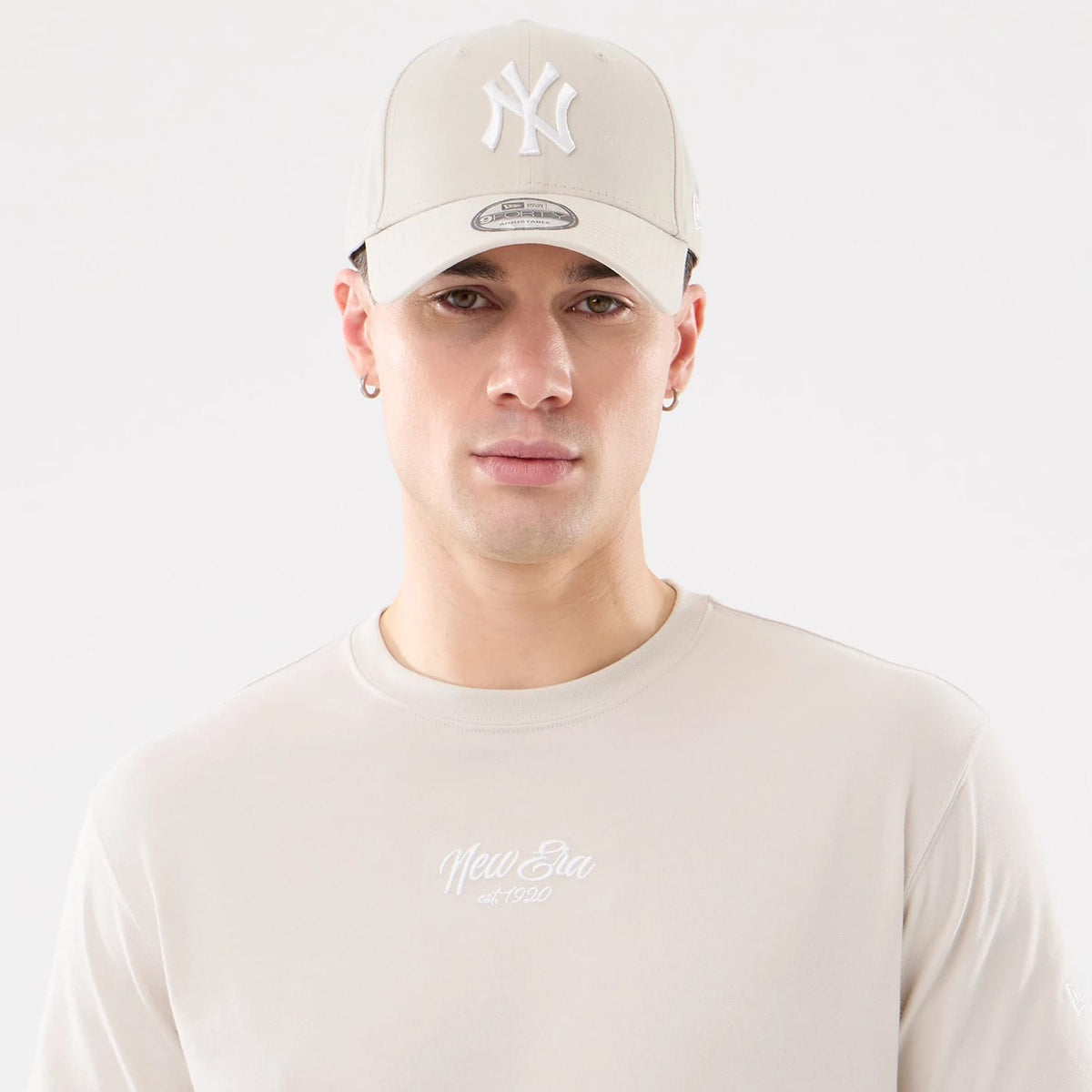 The model is wearing this New Era Resort T-Shirt in natural. 7